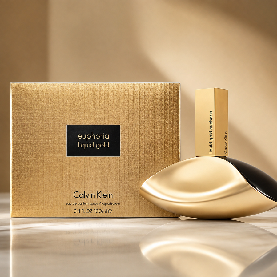 Calvin Klein Euphoria Liquid Gold perfume shown with its textured gold box, a tall matching bottle, and the reflective gold-and-black perfume bottle on a polished marble surface.
